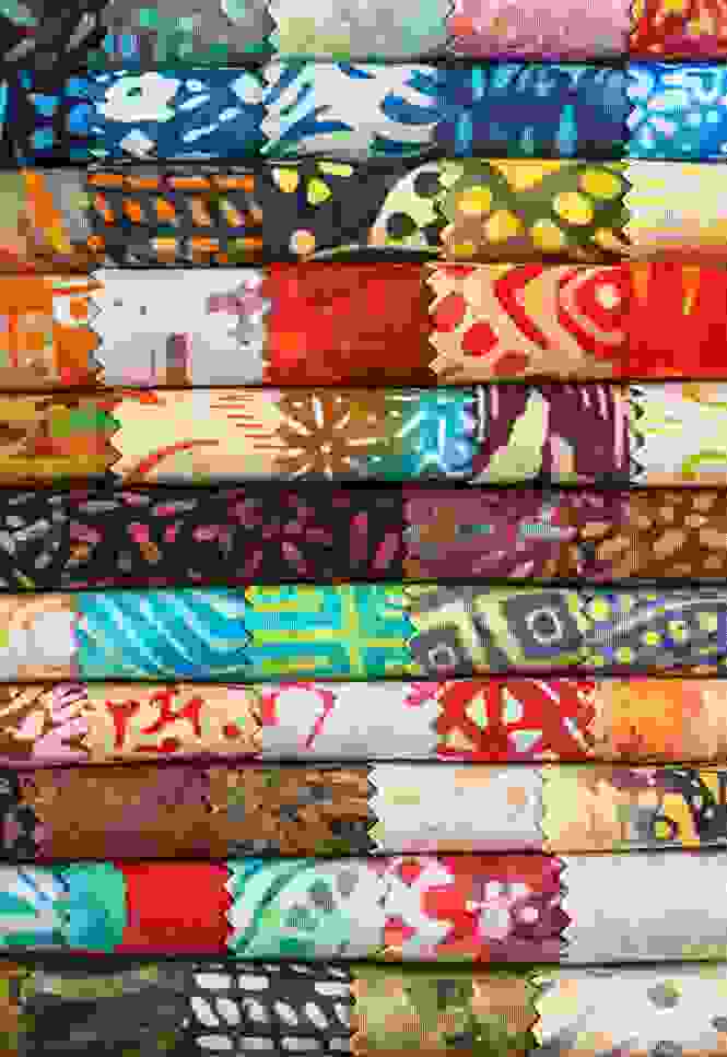 photo of handmade patchwork quilts on the homepage of Red Bridge Quilts