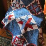 red, white and blue quilted throw with stars