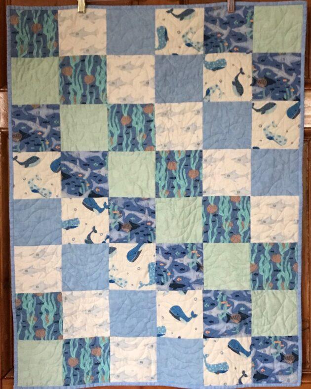 blue baby quilt with fish