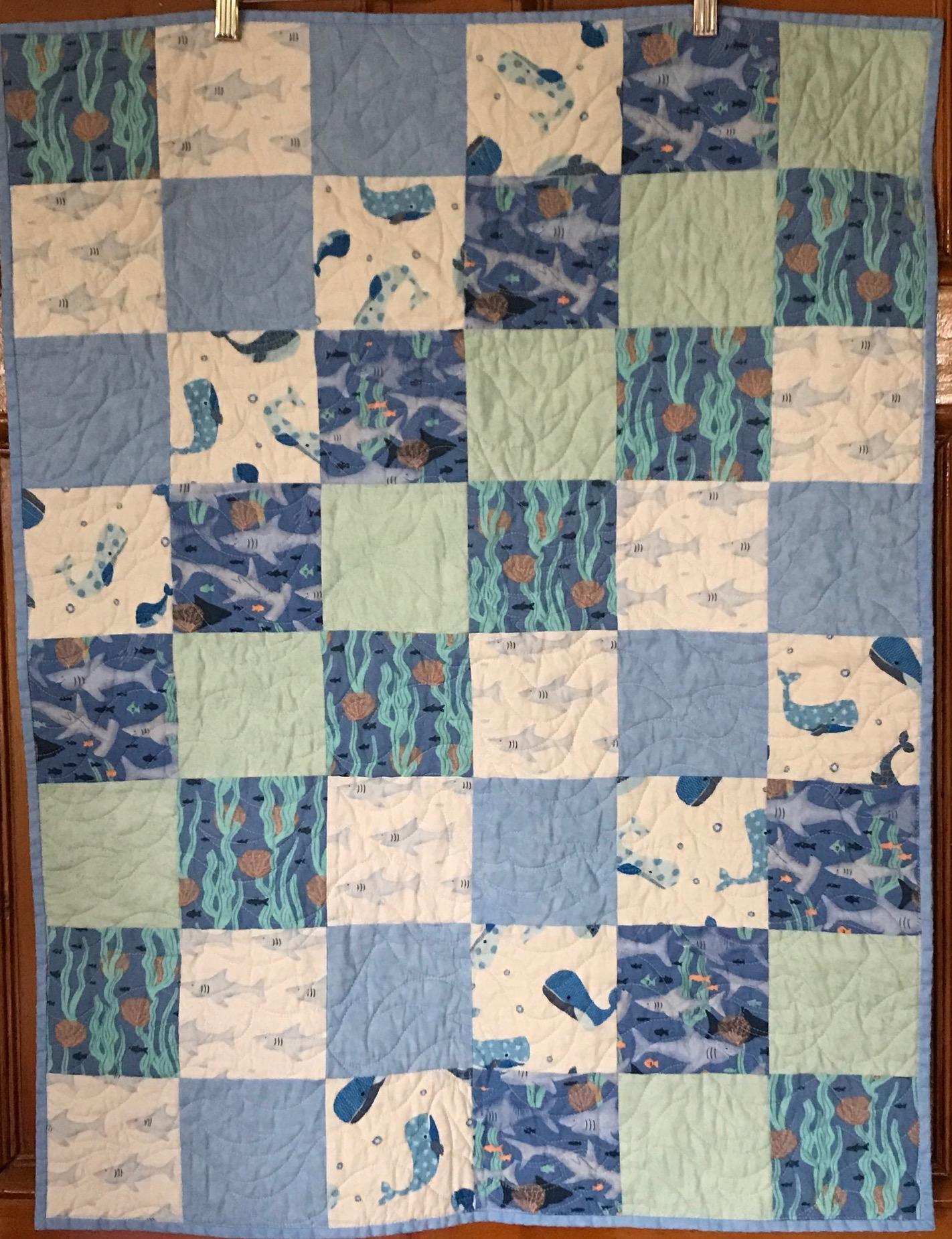 blue baby quilt with fish