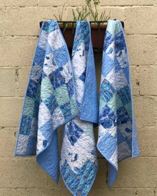 blue baby quilt with fish