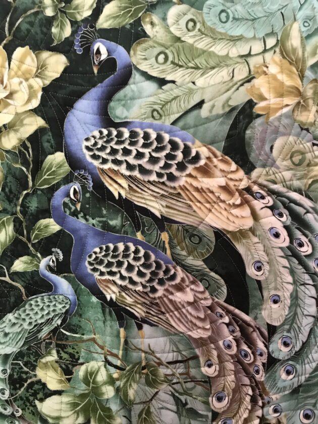 wall hanging with peacocks