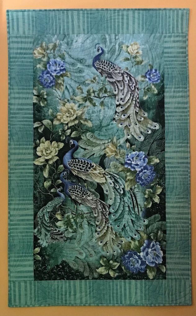 wall hanging with peacocks