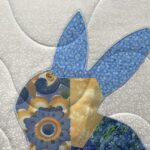appliqued patchwork bunny on a baby quilt