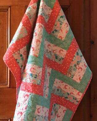 pink and green baby quilt