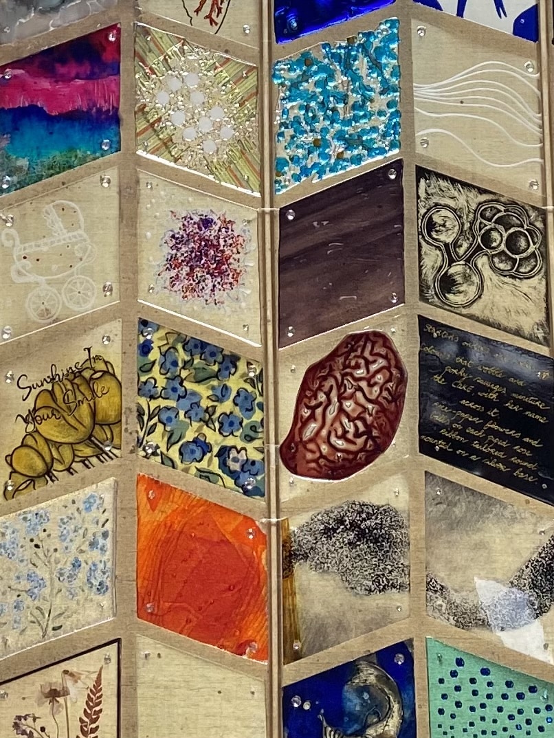 Blocks of patterned glass connected together to look like a quilt