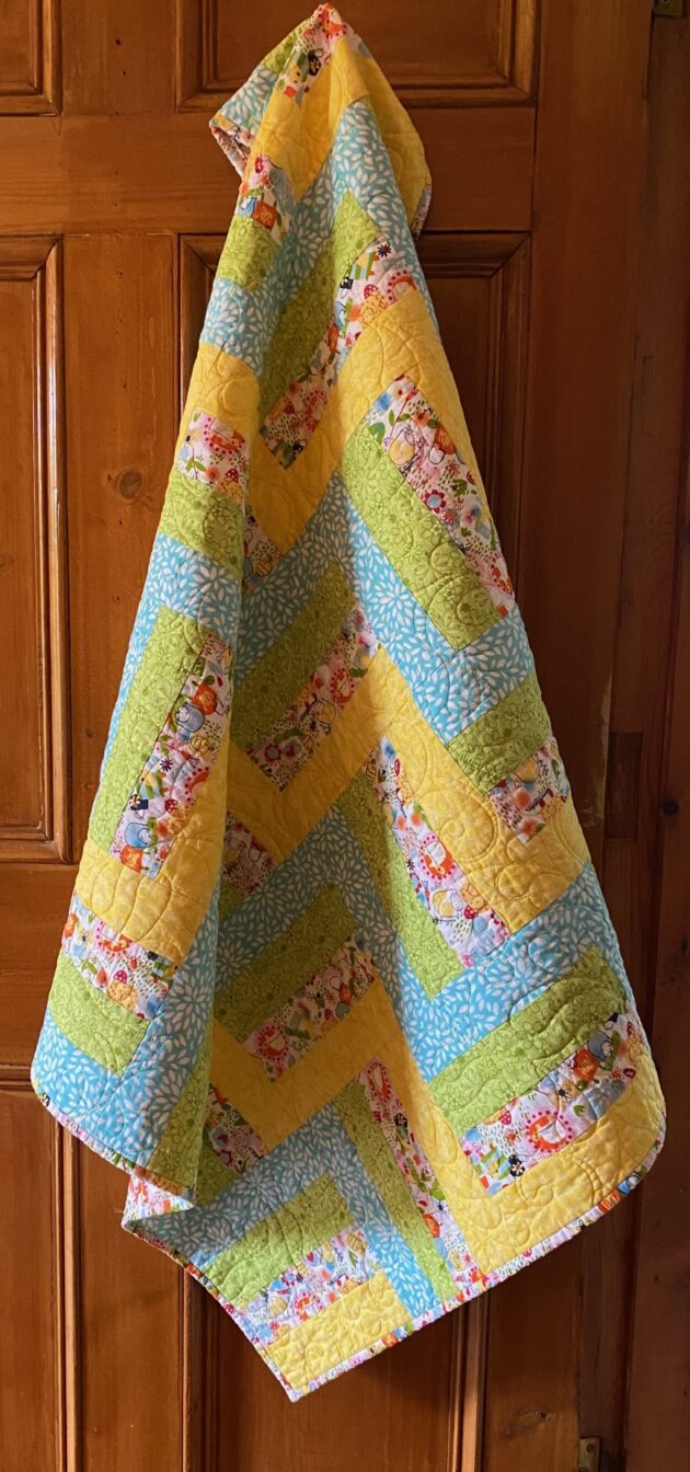 blue, green and yellow baby quilt