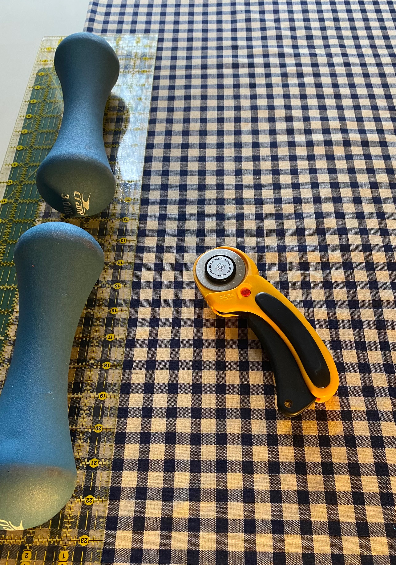 Cutting out homespun fabric for a rag quilt
