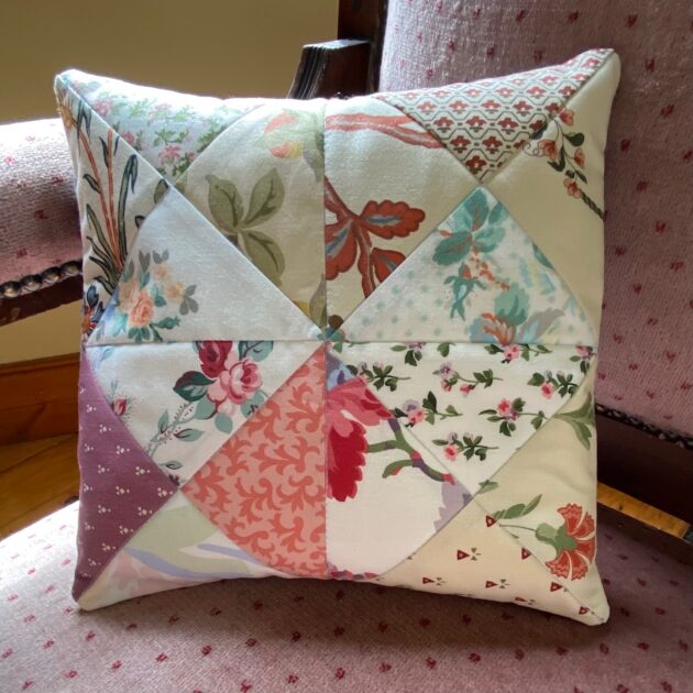 old-fashioned style patchwork cushion in earth tones