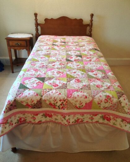 old-fashioned quilt with flowers