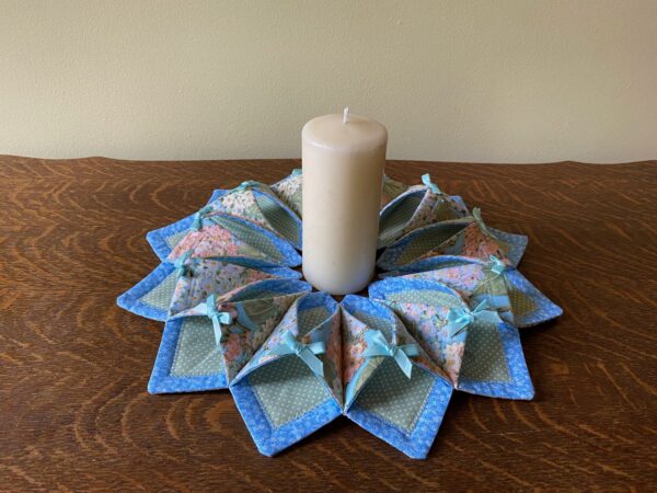 fabric hydrangea wreath shown with candle in centre