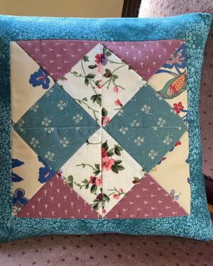 patchwork cushion measuring 35 cm square