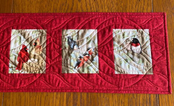 closer detailed look at the right half of the Birds of a Feather Table Runner in Red