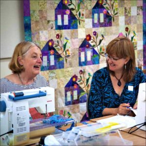 two women at a quilting retreat