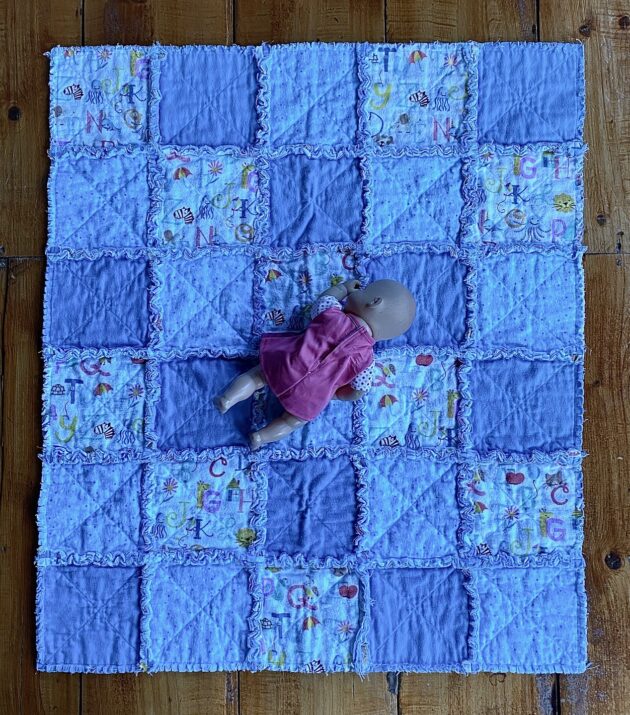 A small rag quilt for a baby boy in 3 different blue fabrics