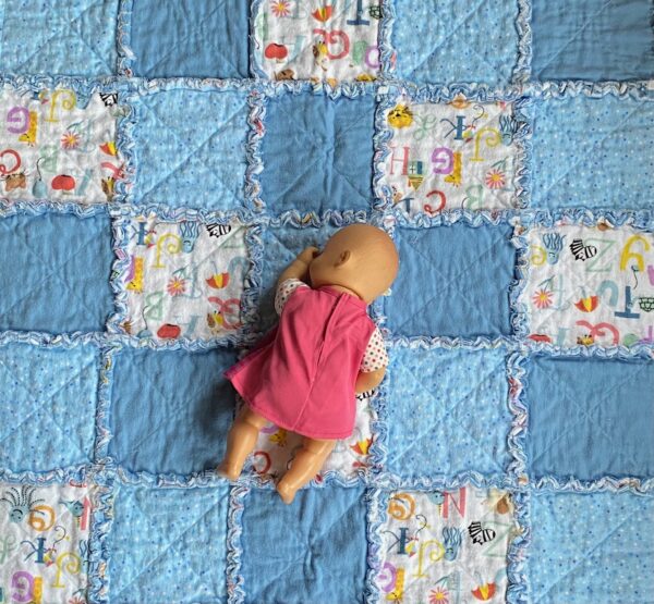 A small rag quilt for a baby boy in 3 different blue fabrics