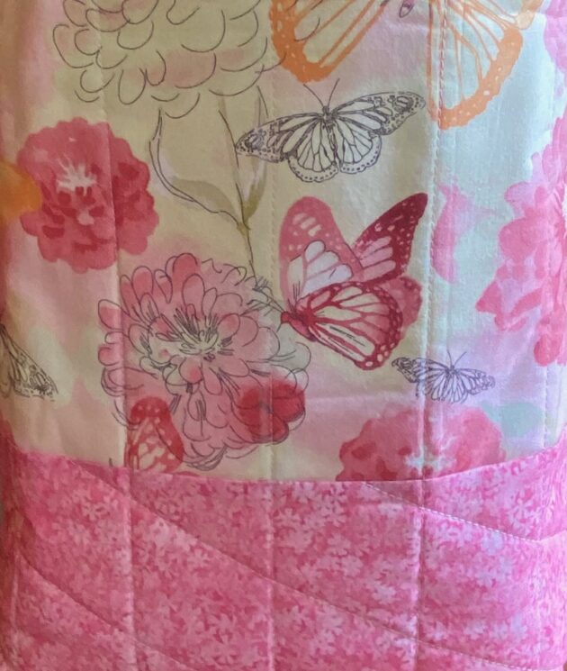 beautiful pink fabrics with butterflies and tiny mums used in a quilted tote bag