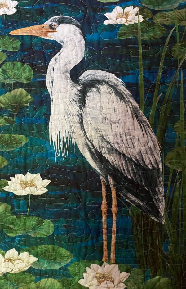 close-up of a quilted grey heron
