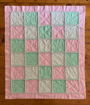 baby rag quilt with pink, mint green and rosebuds on white cotton flannel fabrics