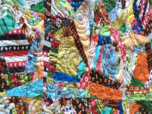 using children's clothing to make a crazy quilt