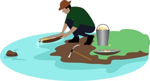 gold digger washes sand in river in search of gold in Pike's Peak gold rush