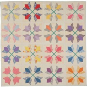 a quilt with a variety of colourful tulip heads