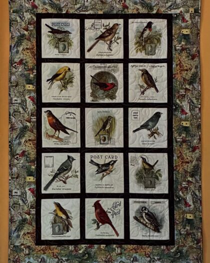 quilted tapestry wall hanging featuring 15 beautiful songbirds in postcard format