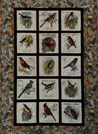 quilted tapestry wall hanging featuring 15 beautiful songbirds in postcard format